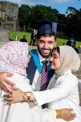 Student celebrating with family members 267x400 - Craven College celebrates its graduates’ success alt