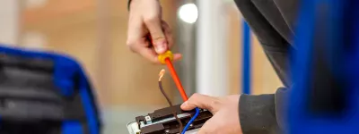 screwdriver in back of plug socket