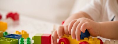 child playing with wooden toy